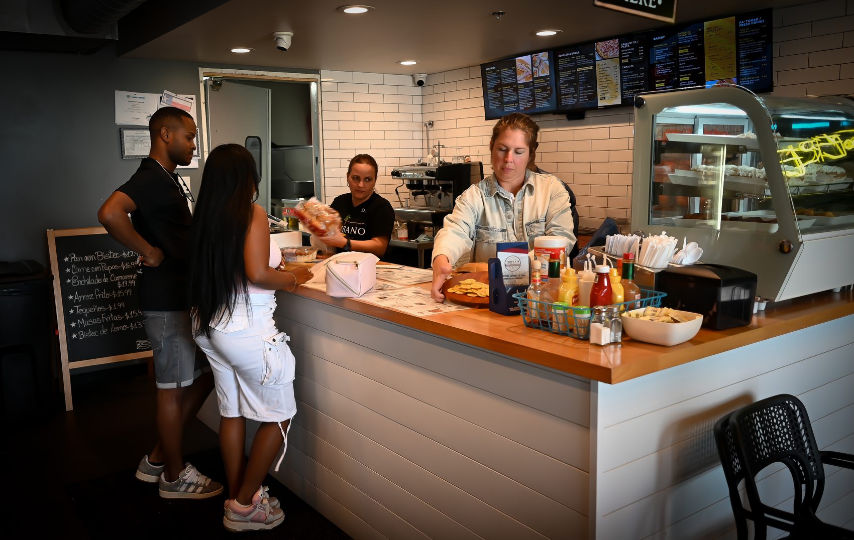 Inside El Cubano Market — the counter and café